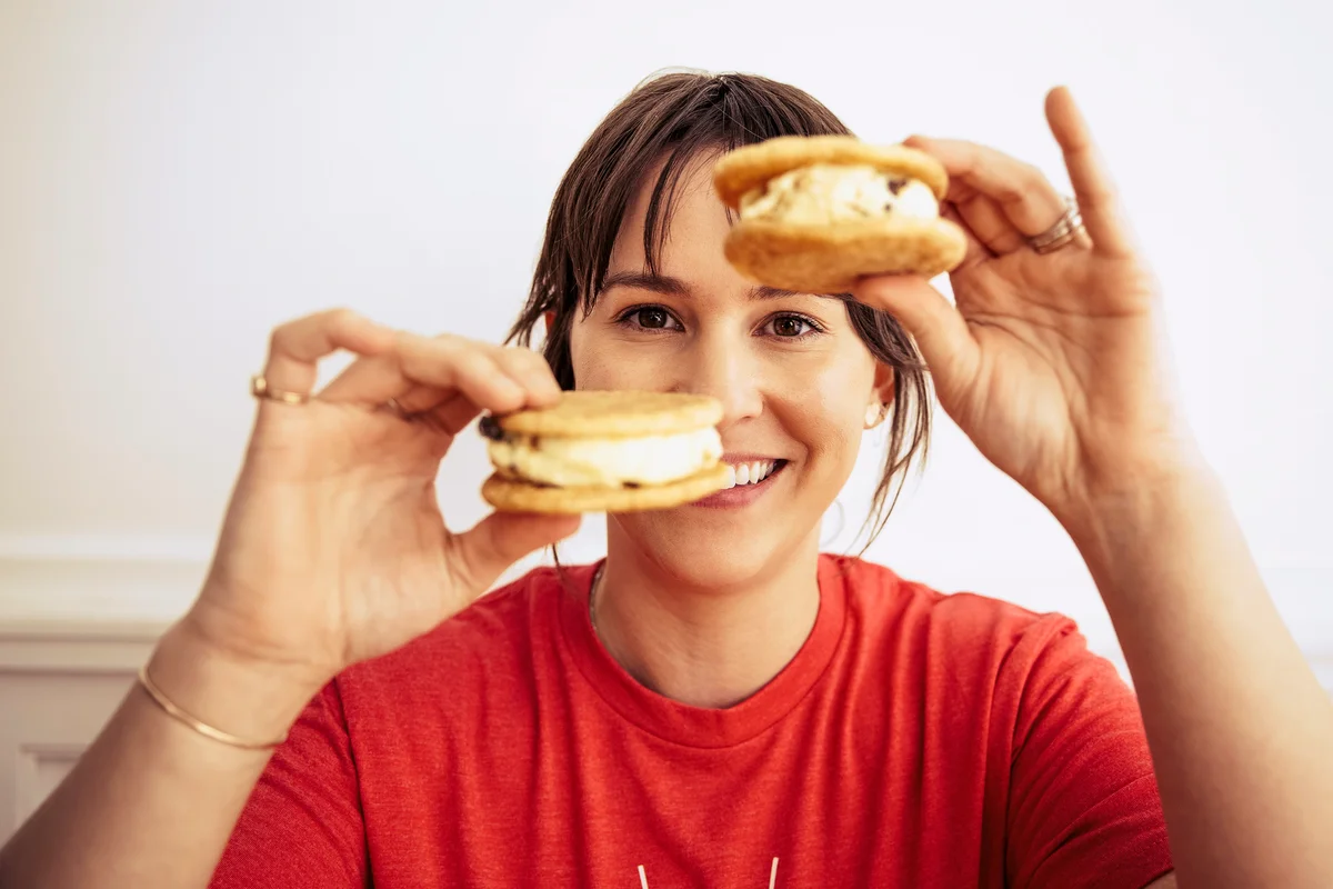 Woman holding ice-cream sandwiches