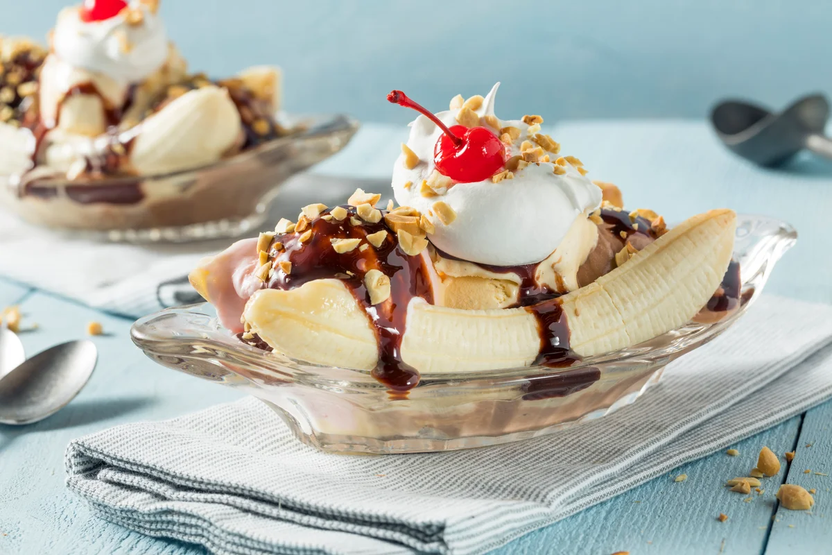 Image of a banana split against a blue background.
