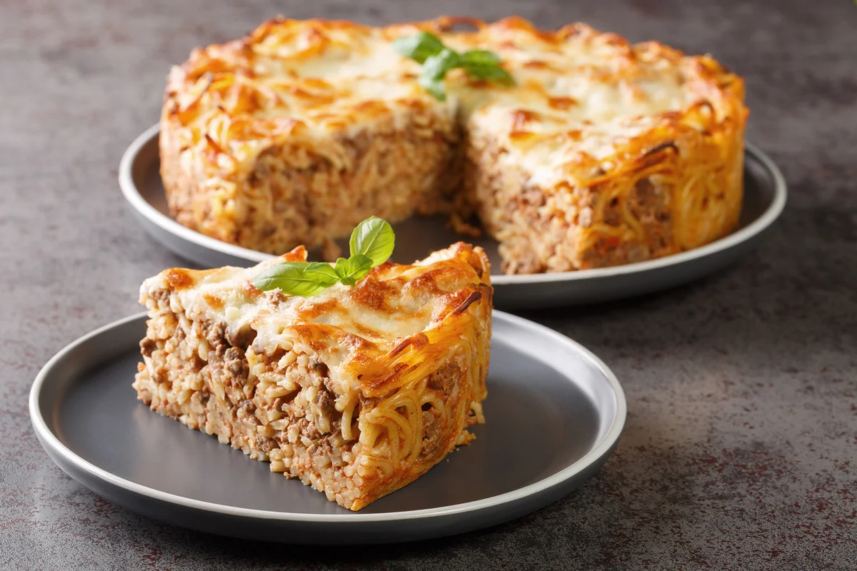 Cheesy Baked Spaghetti Pie with Ground beef, spicy and tomato sauce