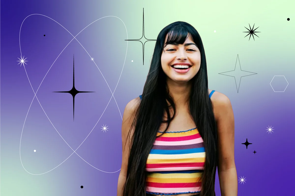 woman standing against colorful background