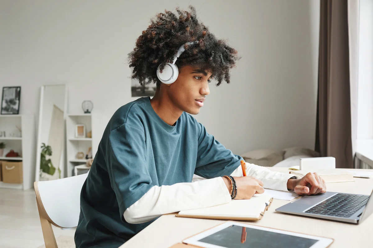 Teenage boy studying at home