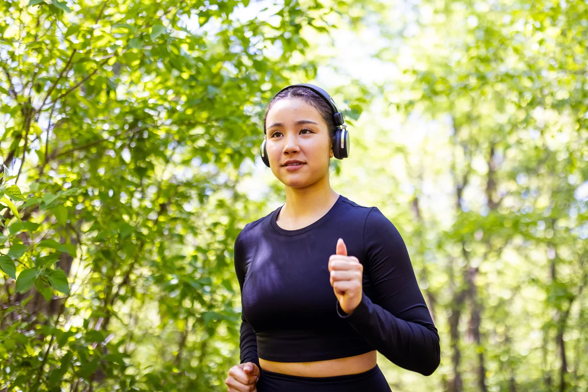 Teenage girl jogging with headphones