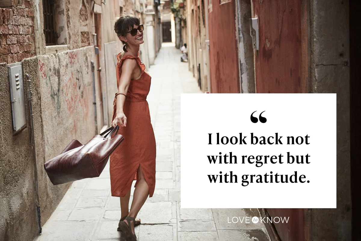 Young woman walks joyfully looking back