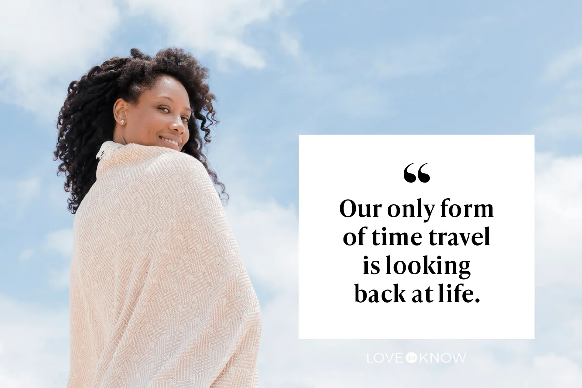 Smiling woman wrapped in towel and looking back