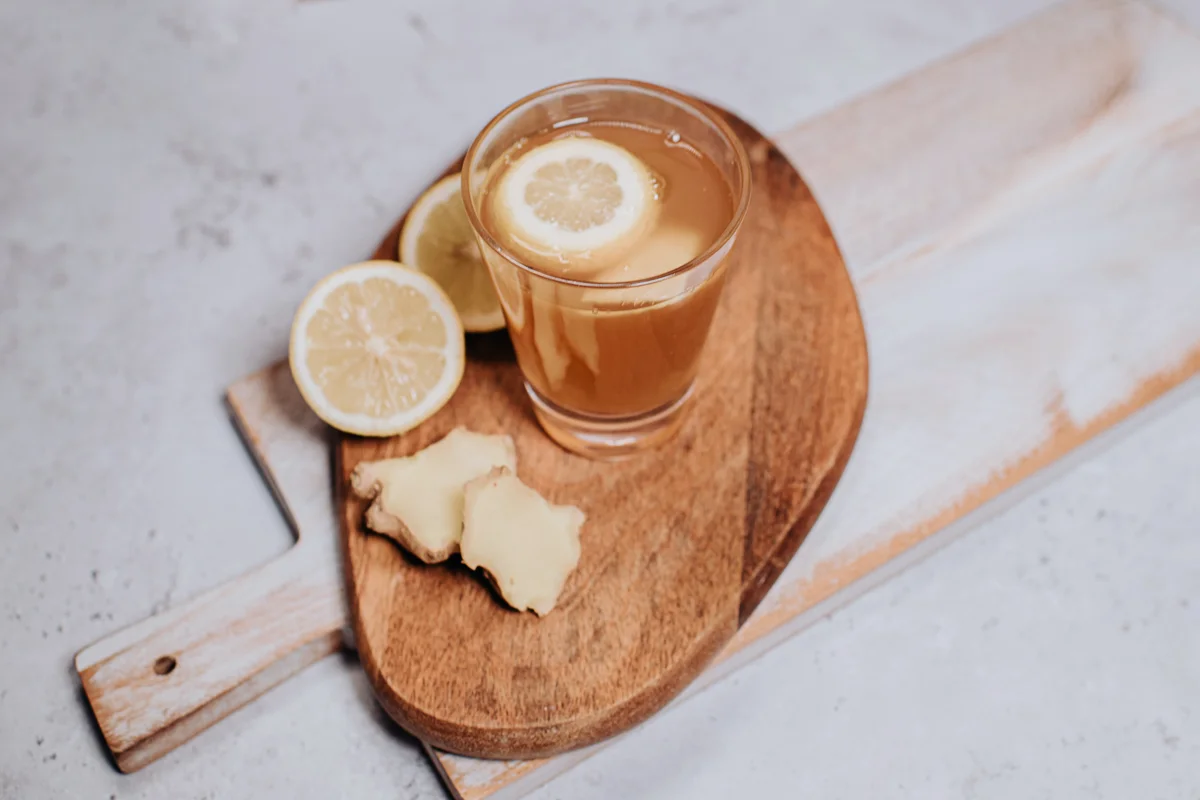 Drink garnished with lemon and ginger