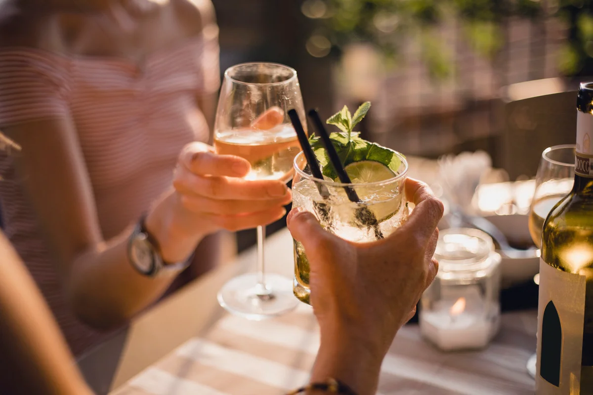 Celebratory toast with white wine cocktails