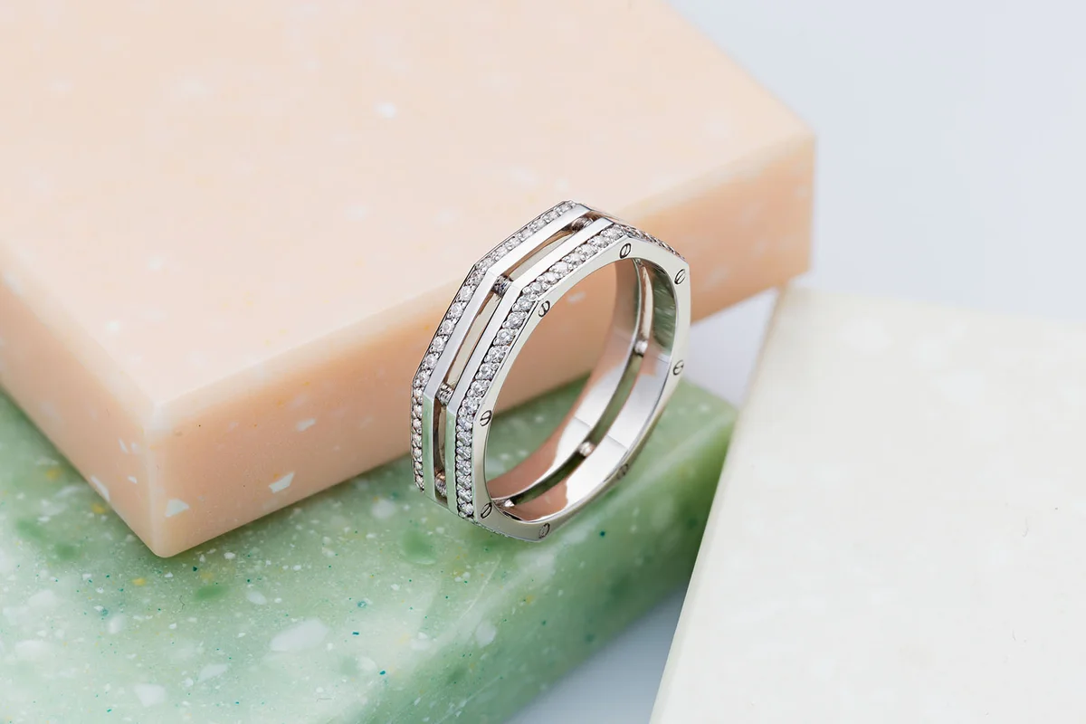 White gold screw nut shape wedding ring with diamonds