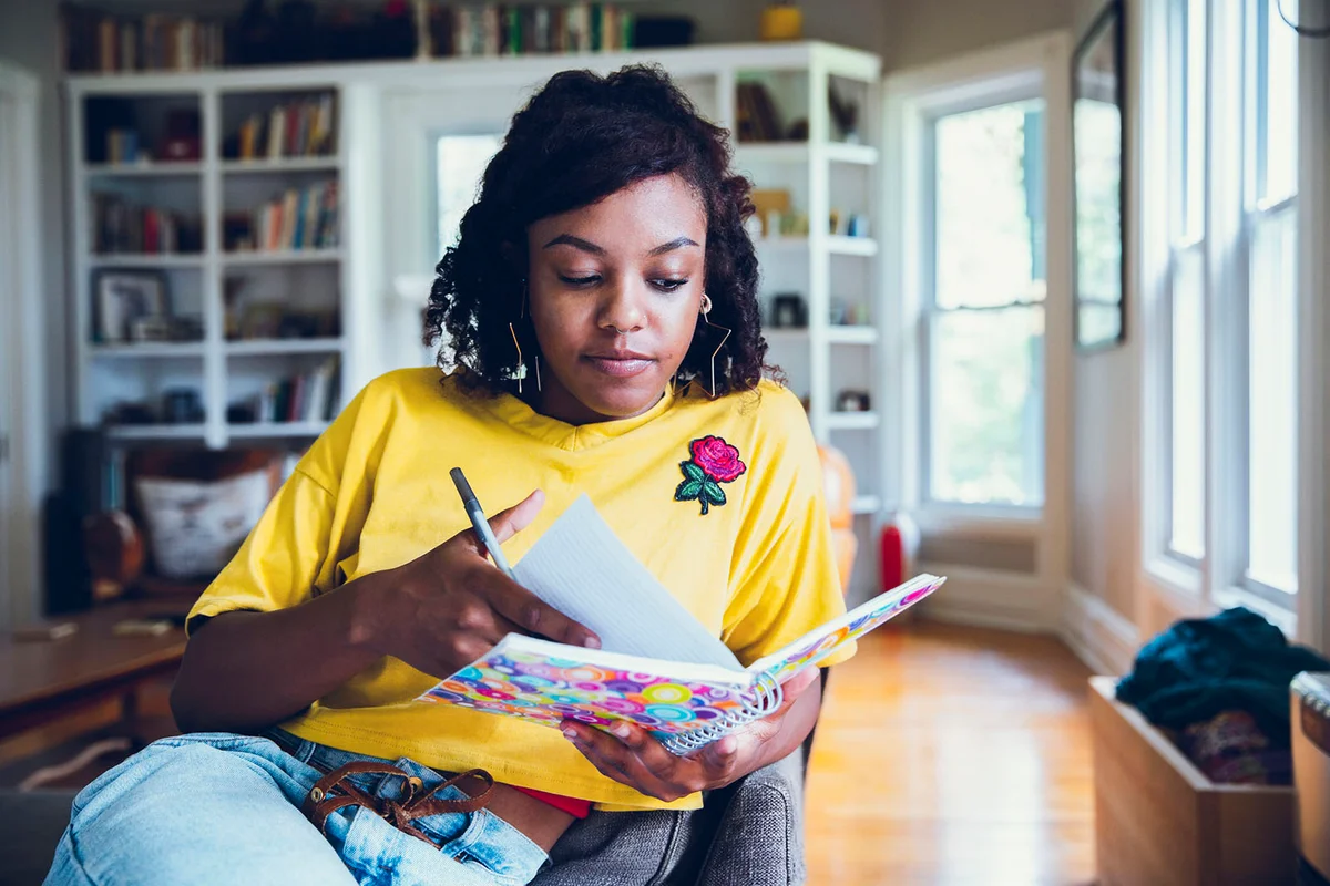 woman writing in notebook