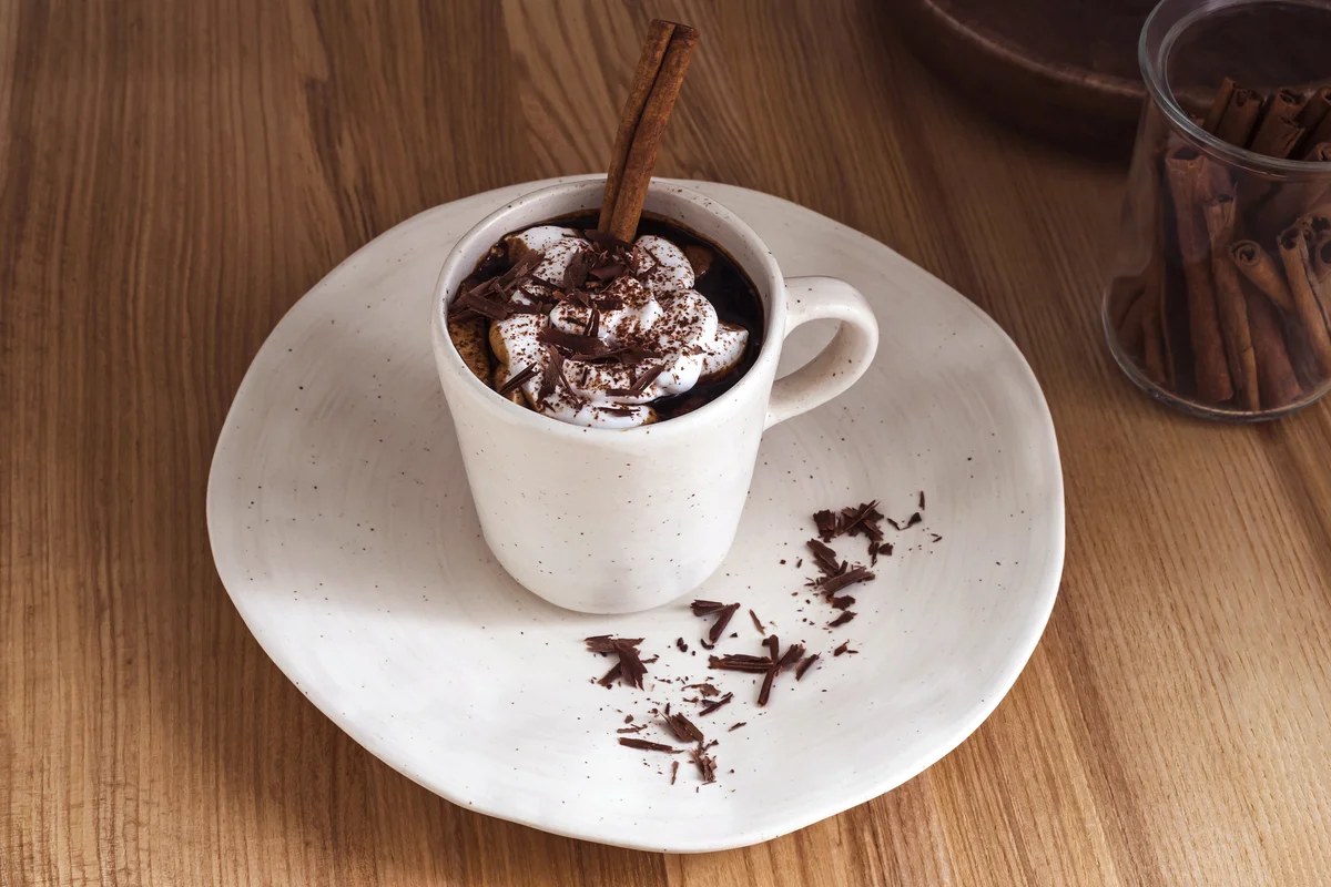 Cup of hot chocolate with whipped oat cream