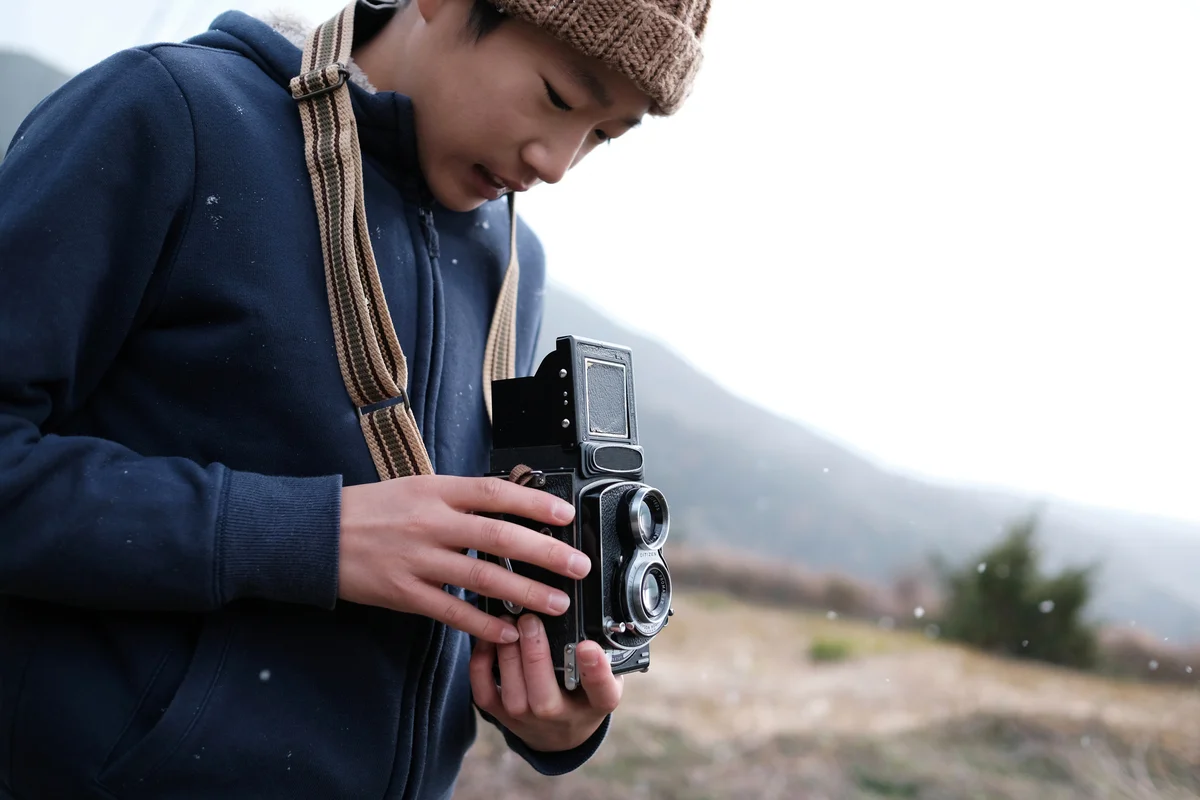 Man holding a medium format camera