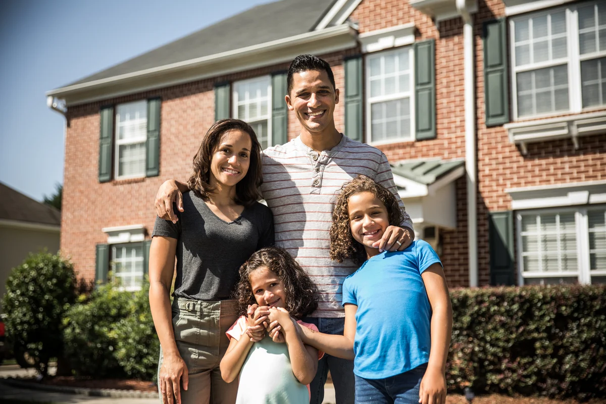Family outside of their home