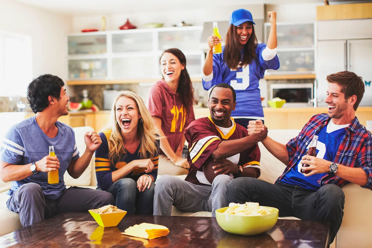 Friends Watching Football in Living Room