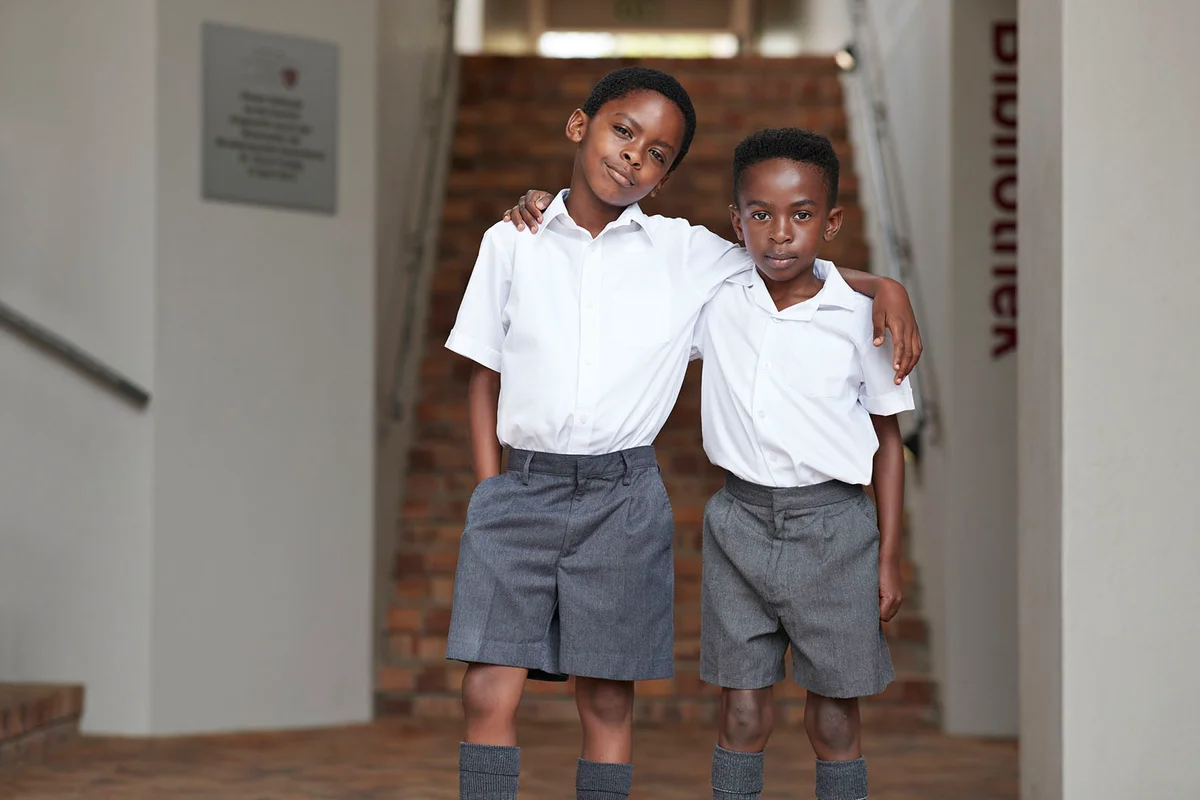 two cool school boys in uniforms