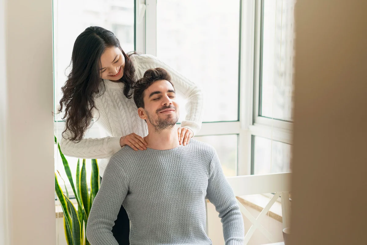 woman massaging her boyfriend