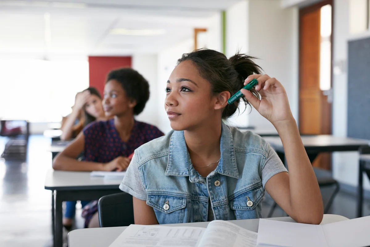 young person awake thinking in class
