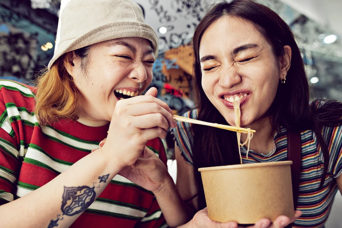 friends eating noodles