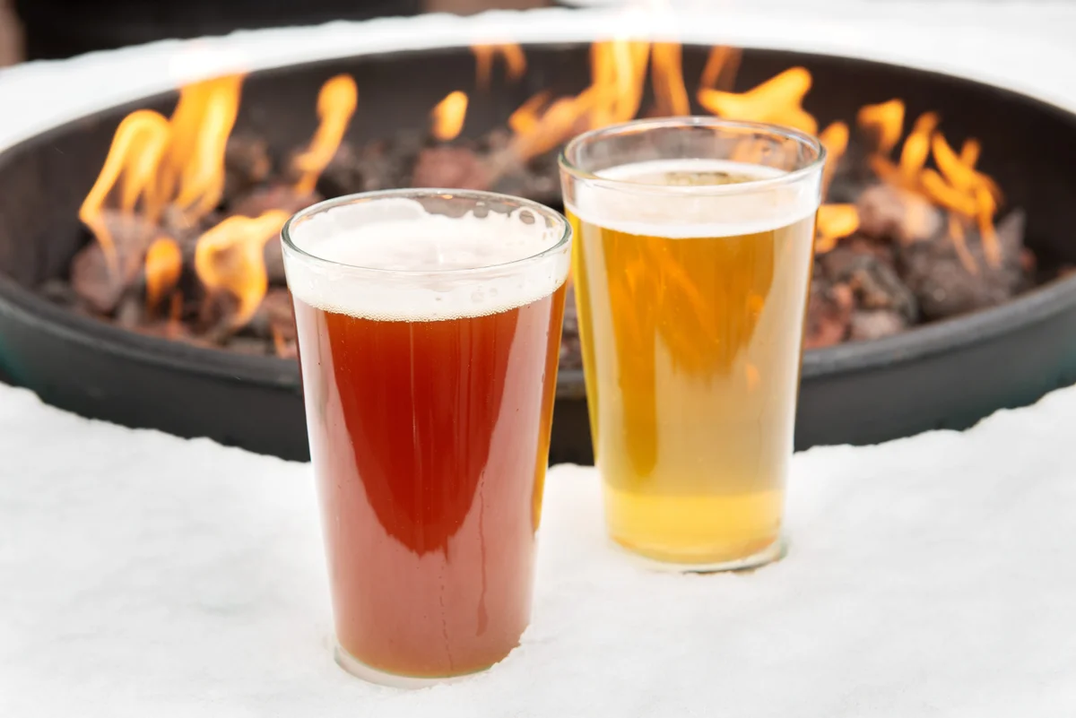 beer by a fire pit in winter