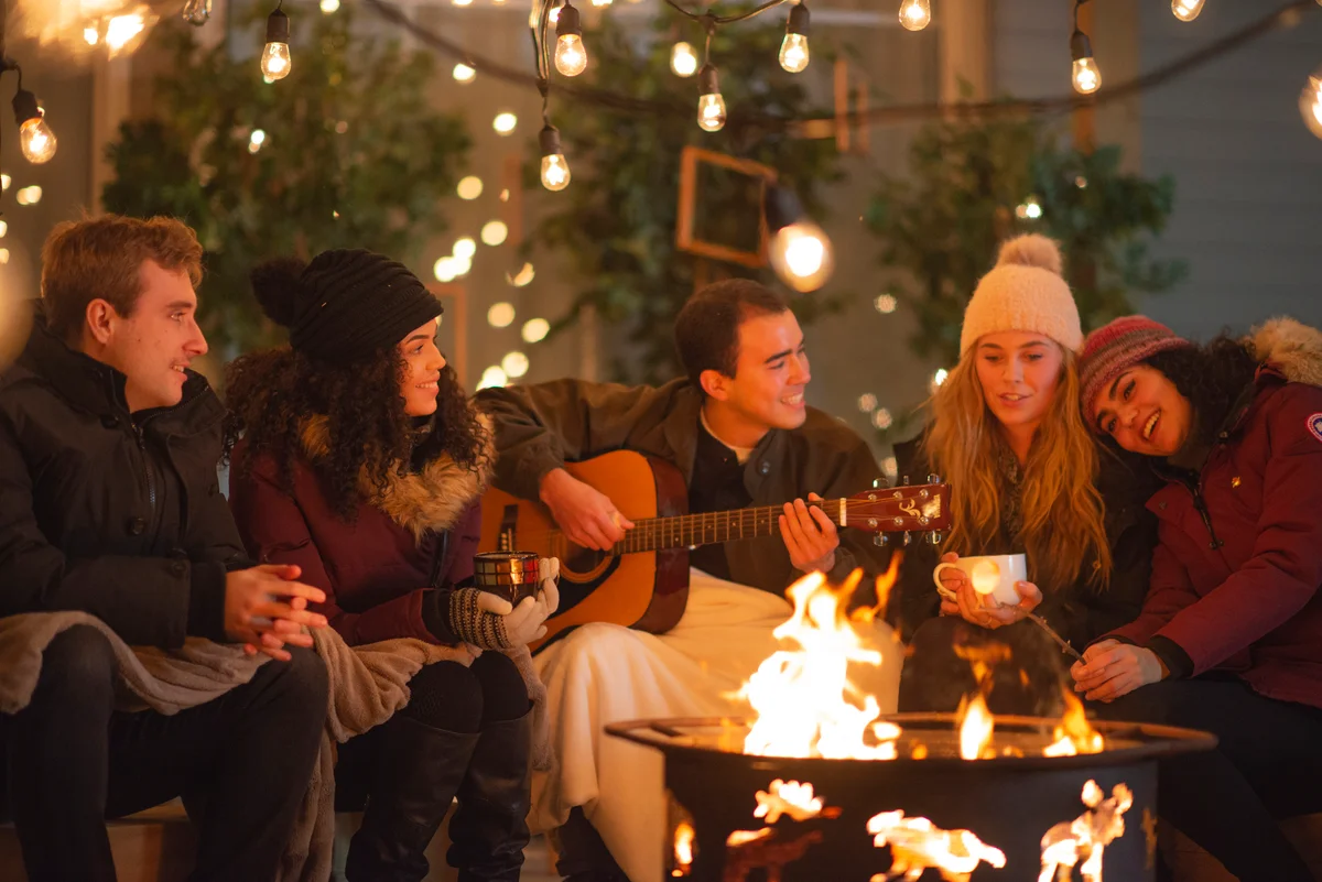 friends by a fire pit