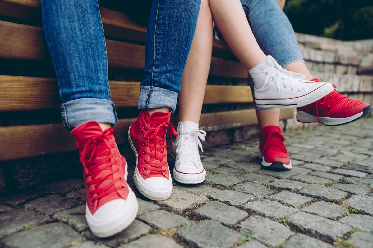 Female legs in sneakers