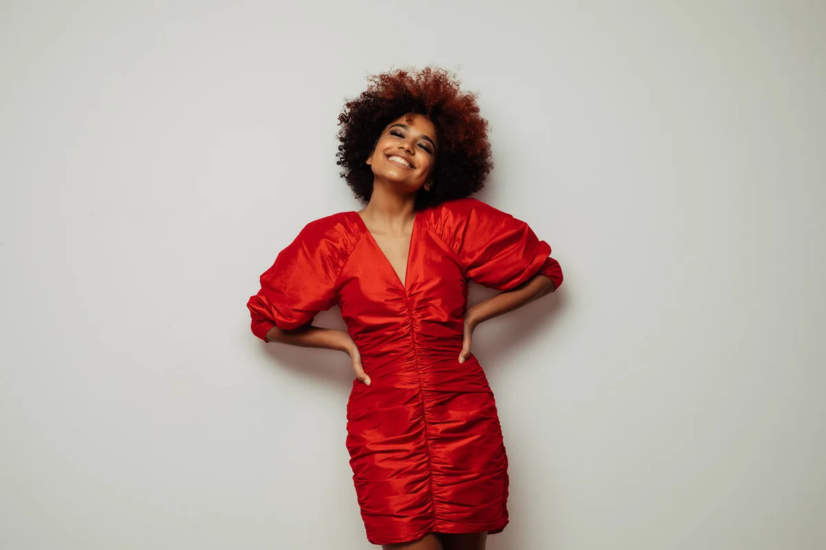 Beautiful smiling girl with curly hairstyle