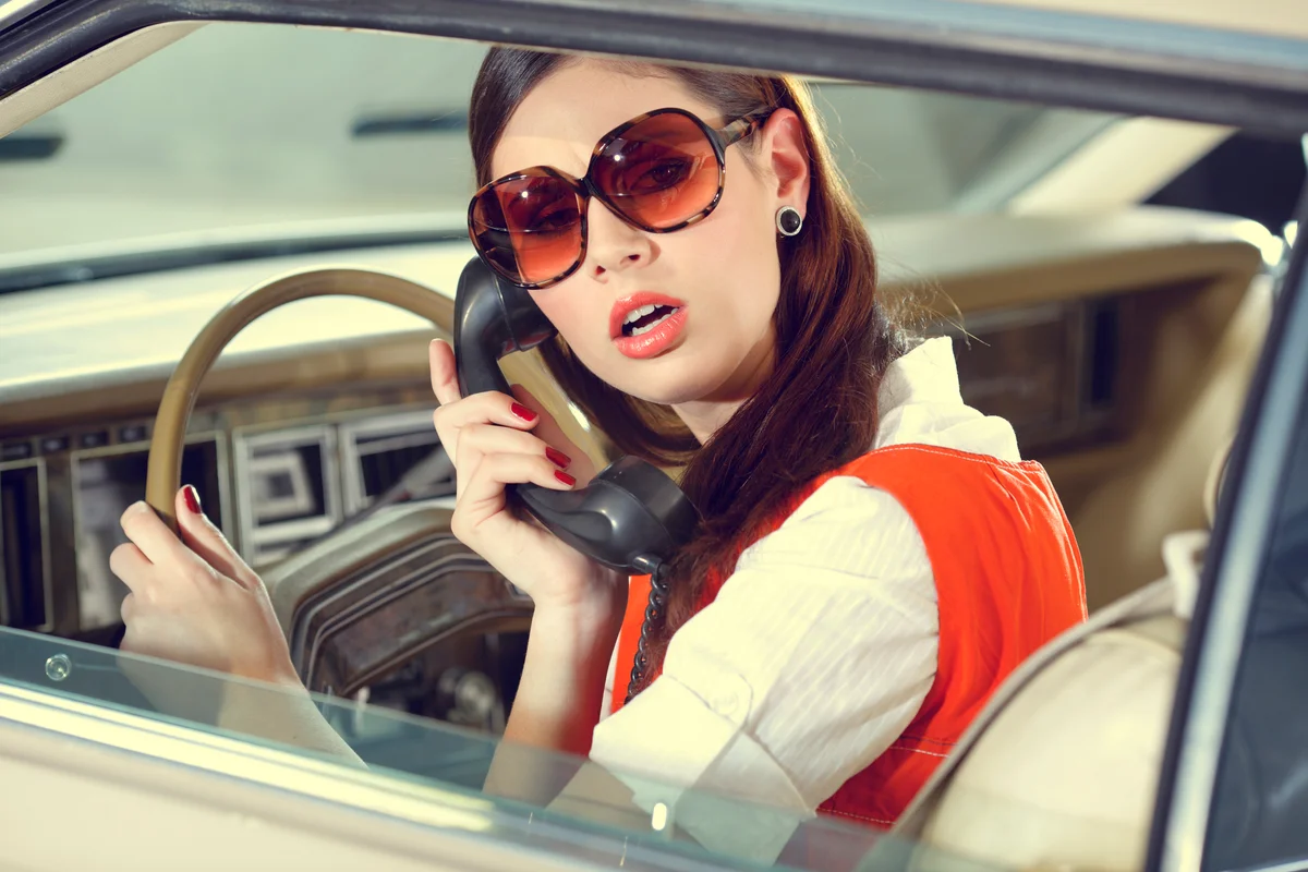 70s girl in the old American car