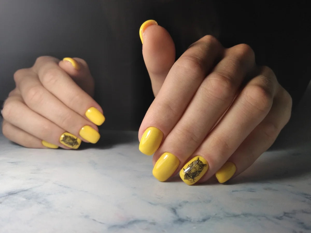 Yellow glossy gel polish
