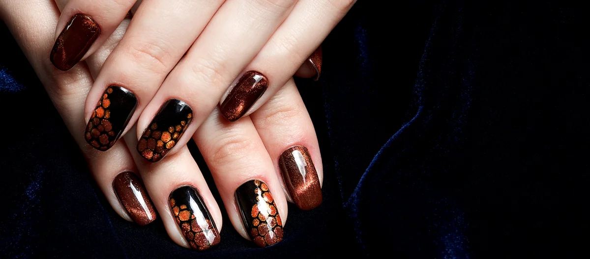 brown "cat eye" manicure