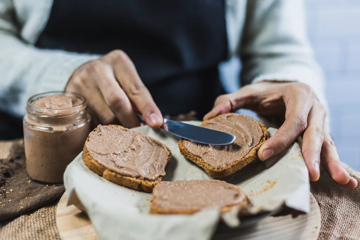 man spreading cookie butter