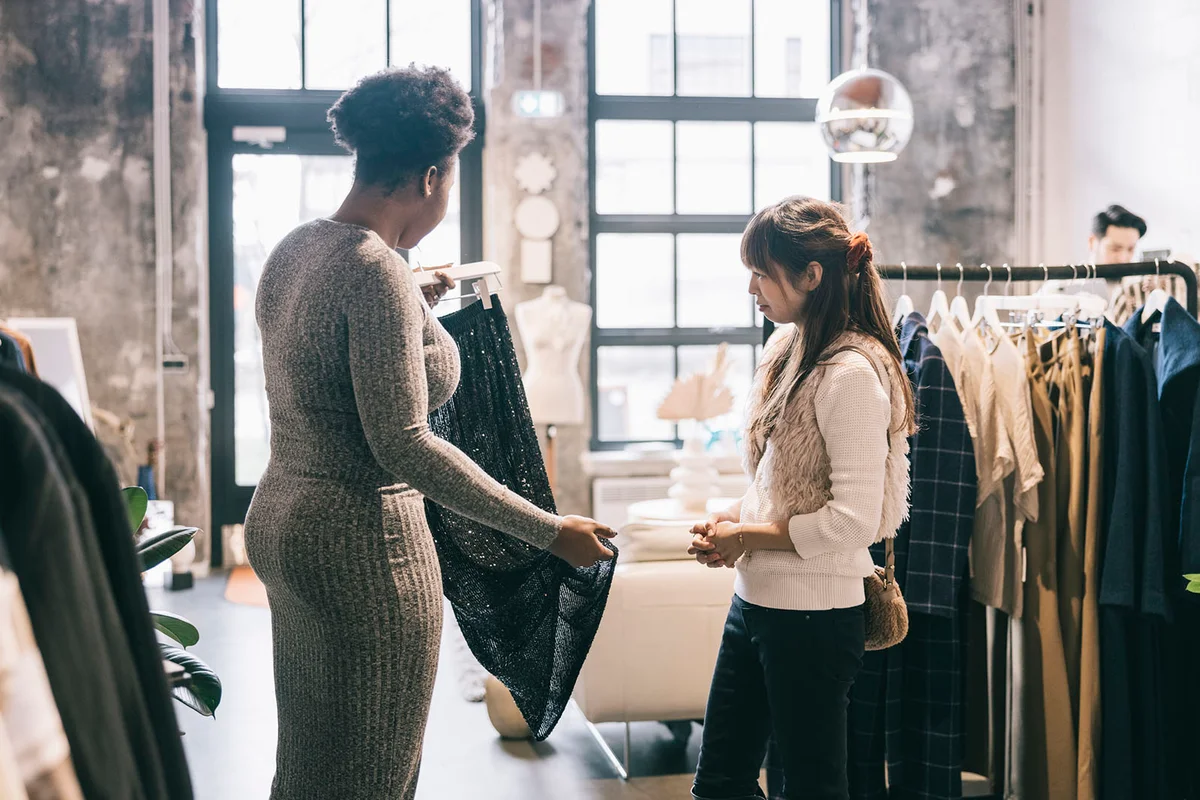 Friends shopping for new clothes