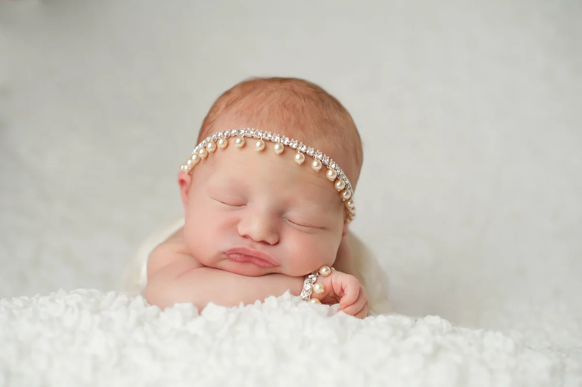 newborn with jewels