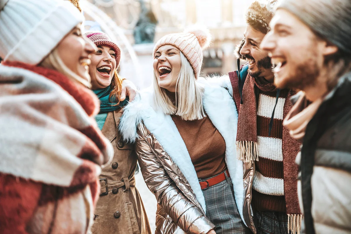 Happy group of friends having fun walking on city street