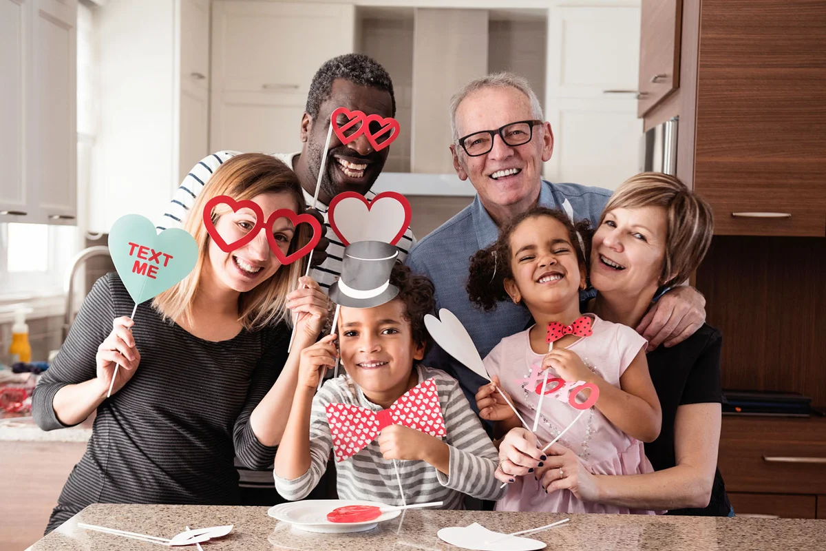 family doing photobooth during Valentine's day