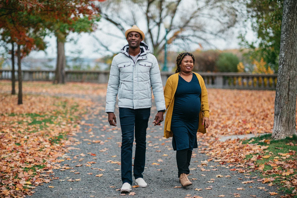 pregnant couple walking