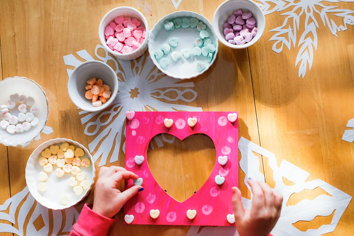 Child Making a Picture Frame for Valentine's Day