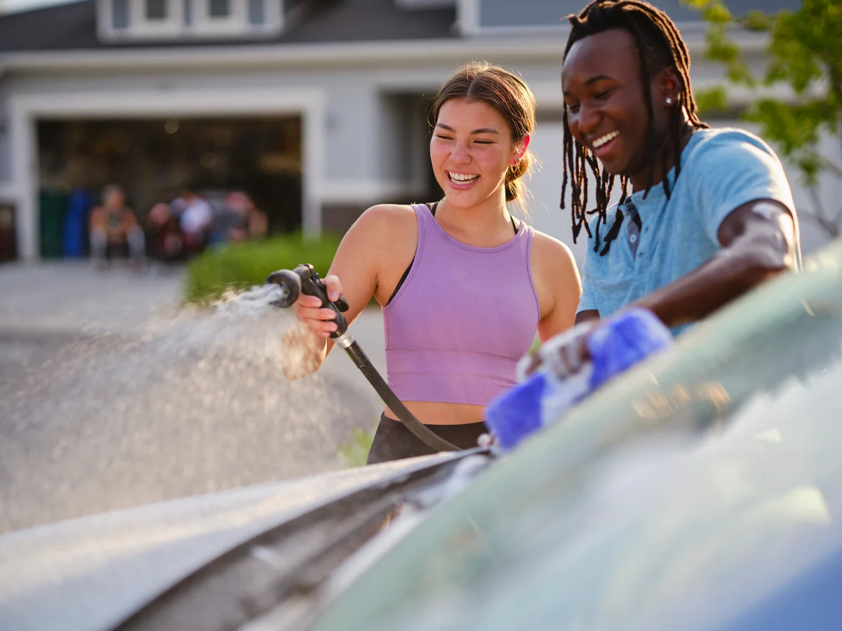 couple washing a car