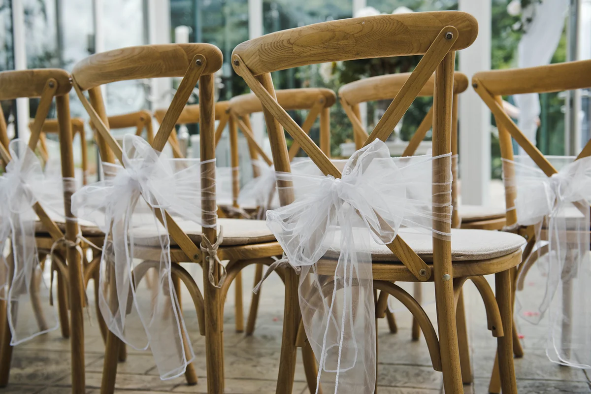 Wedding decor . Close-Up Of Chairs By Table During Wedding Ceremony