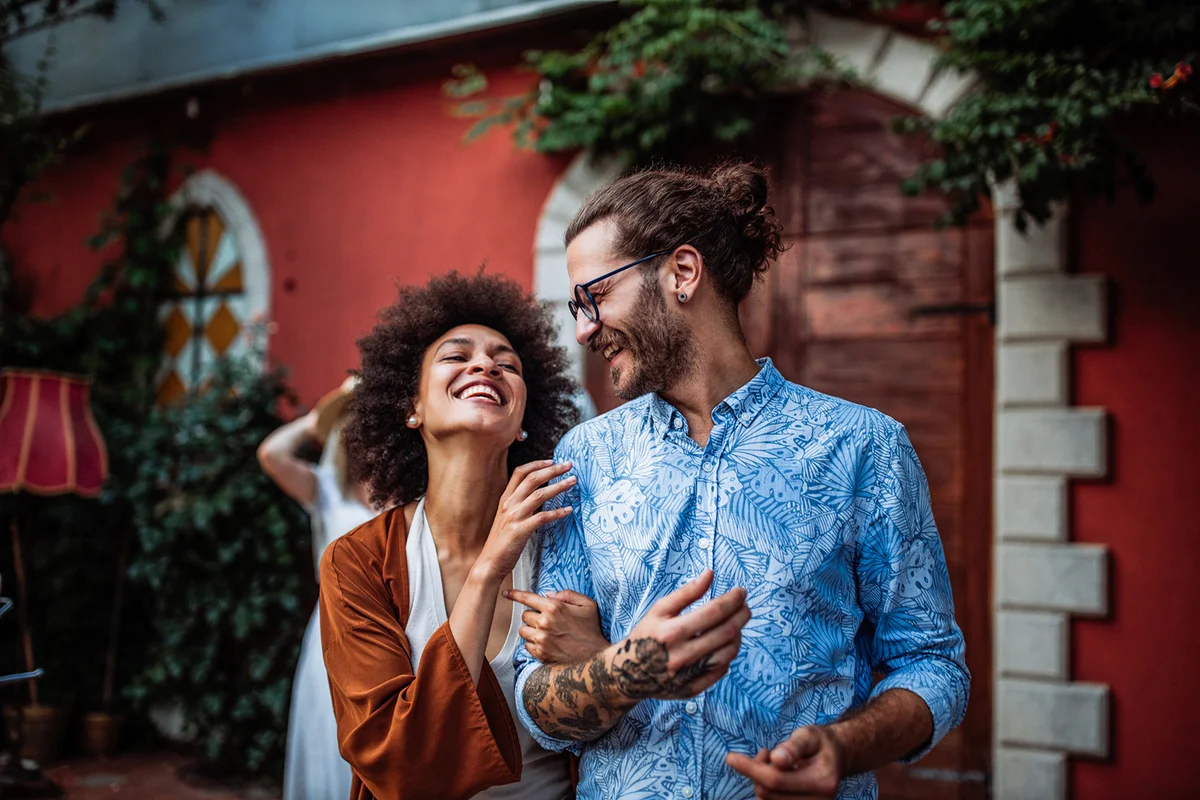 Smiling couple walking down the street