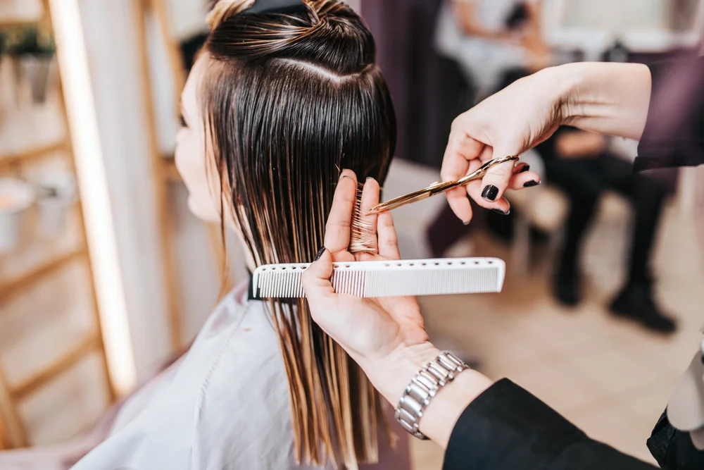 Young woman getting her haircut at a salon