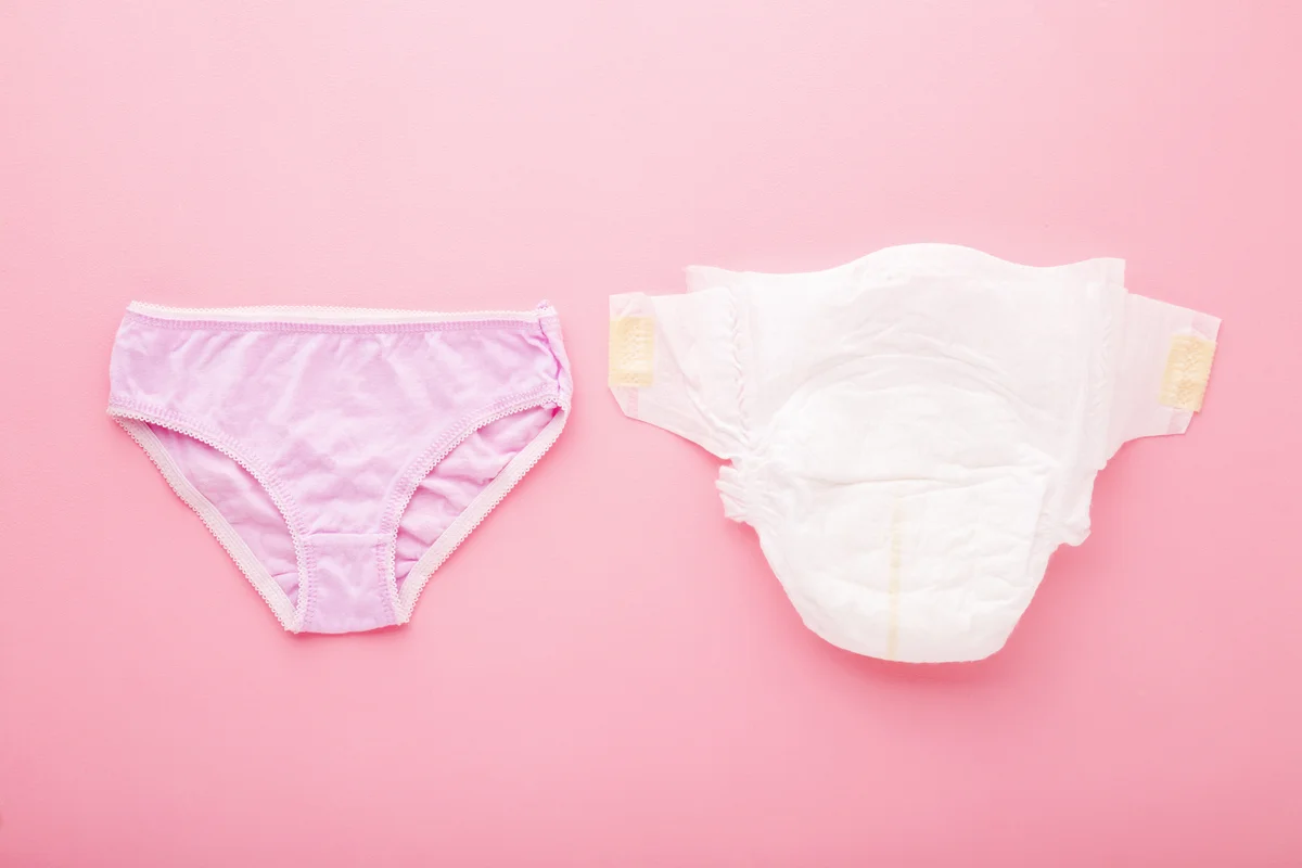 Baby diaper and purple underwear