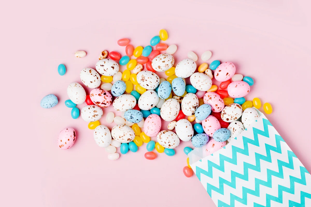 Easter candy chocolate eggs and Jellybean in a party paper bag