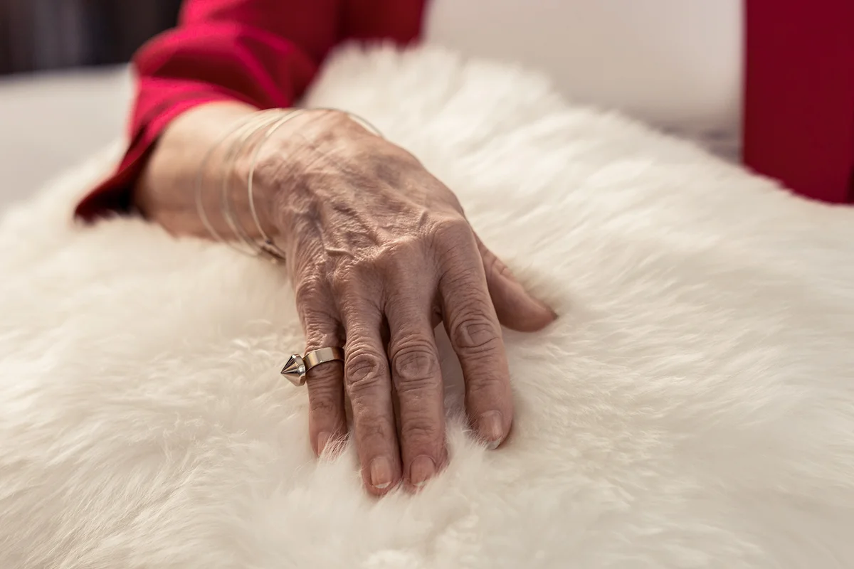 Female wrist with trendy ring on the pinky finger