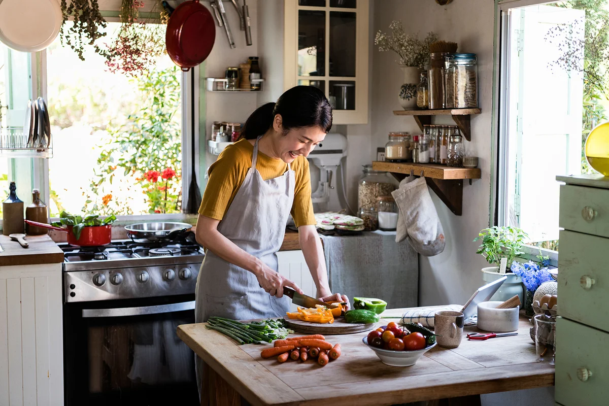 Woman cooking in a countryside kitchen