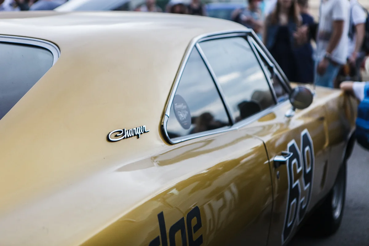Detail shot of the side of a gold Dodge Charger