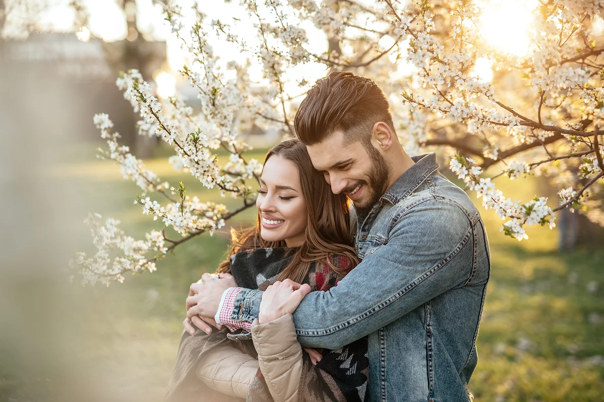 Couple among blooming trees