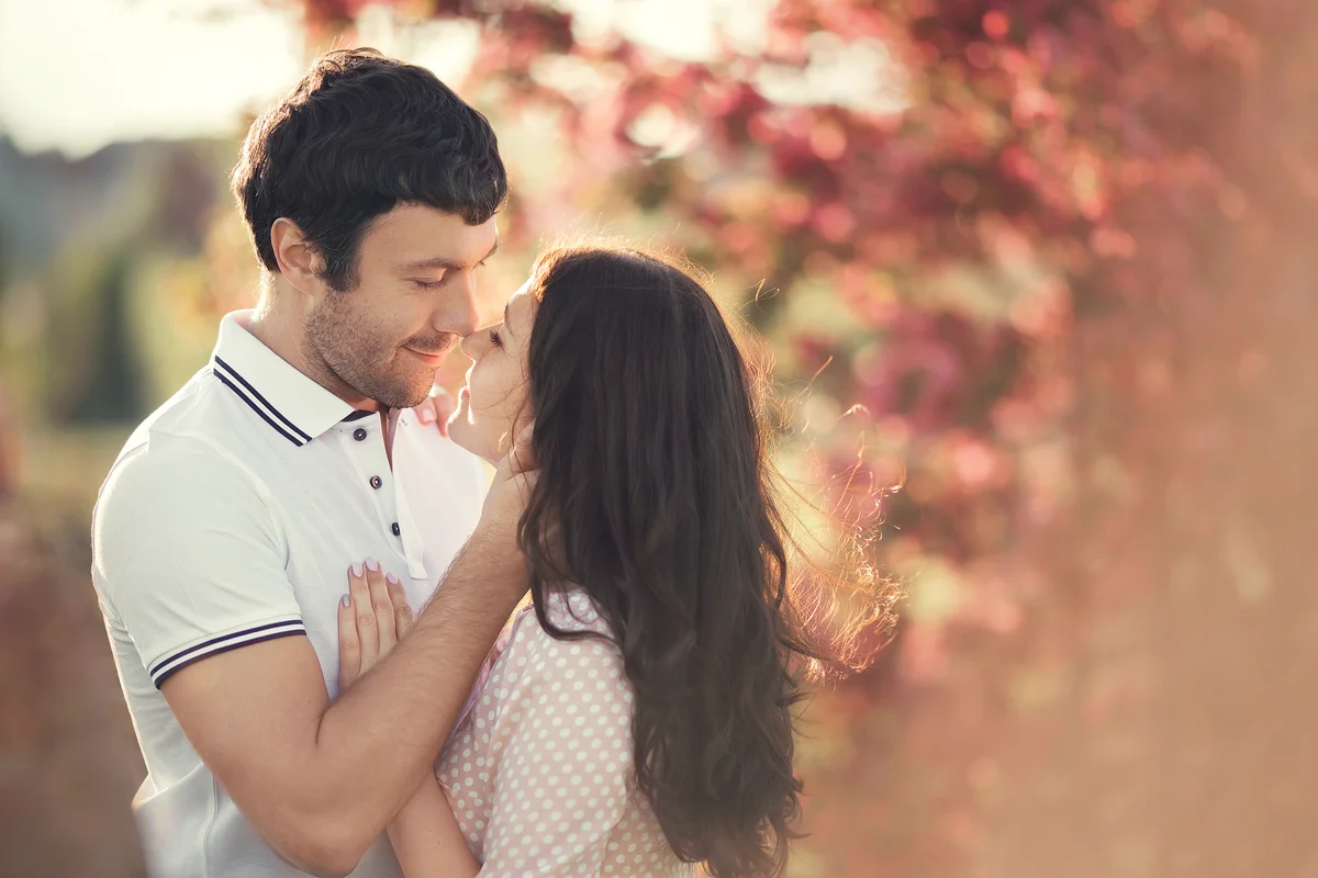 Couple in love near cherry blossoms