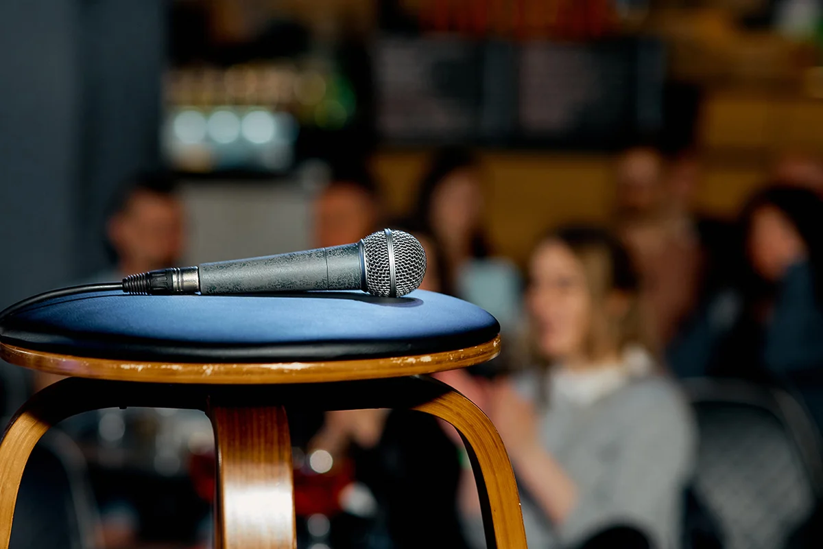 microphone lies on a chair on the stage before the performance