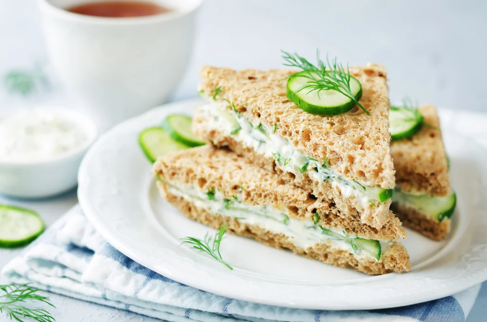 Detail image of cucumber sandwiches on a plate