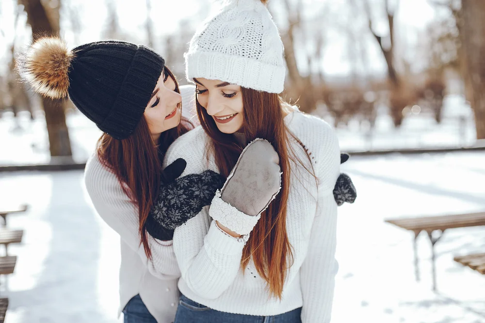 Romantic couple of women hugging in winter