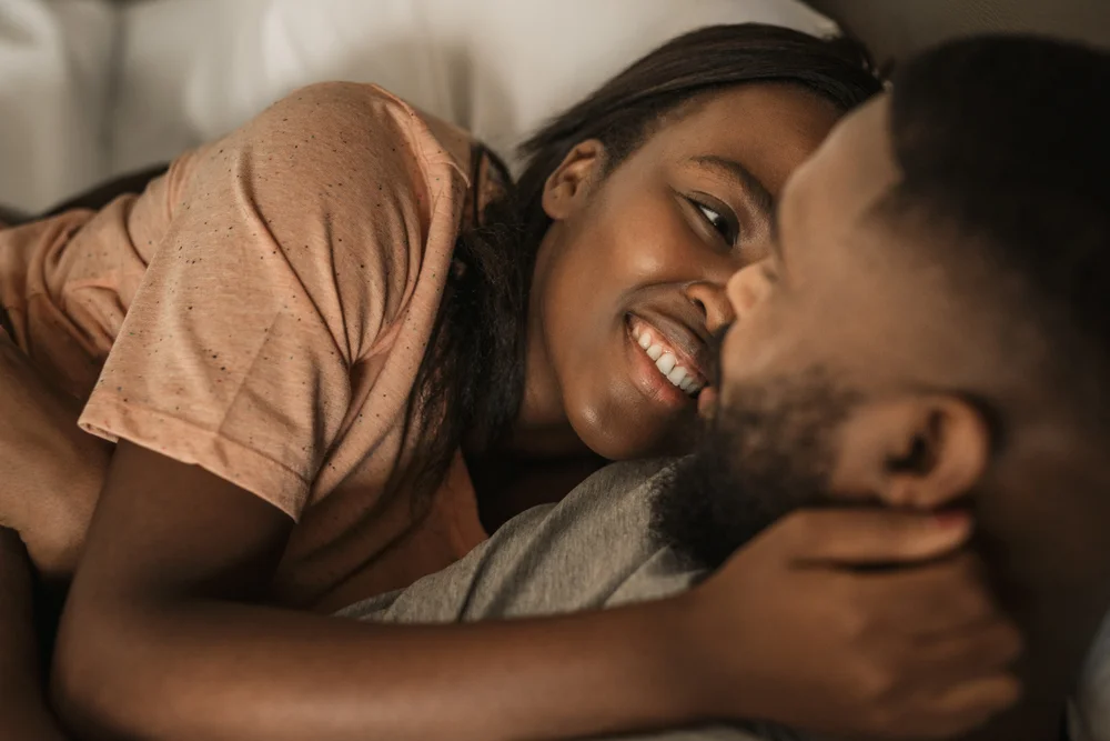 Romantic cozy couple lying close to each other