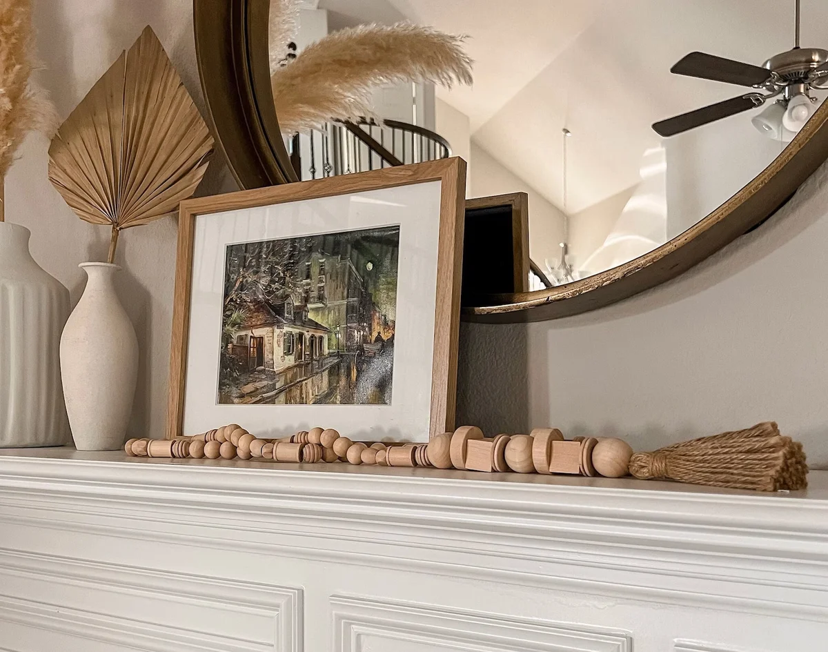 Wooden bead garland on mantel